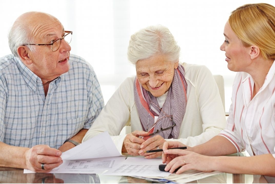 An advisor from {{Brand}} speaking warmly with a family